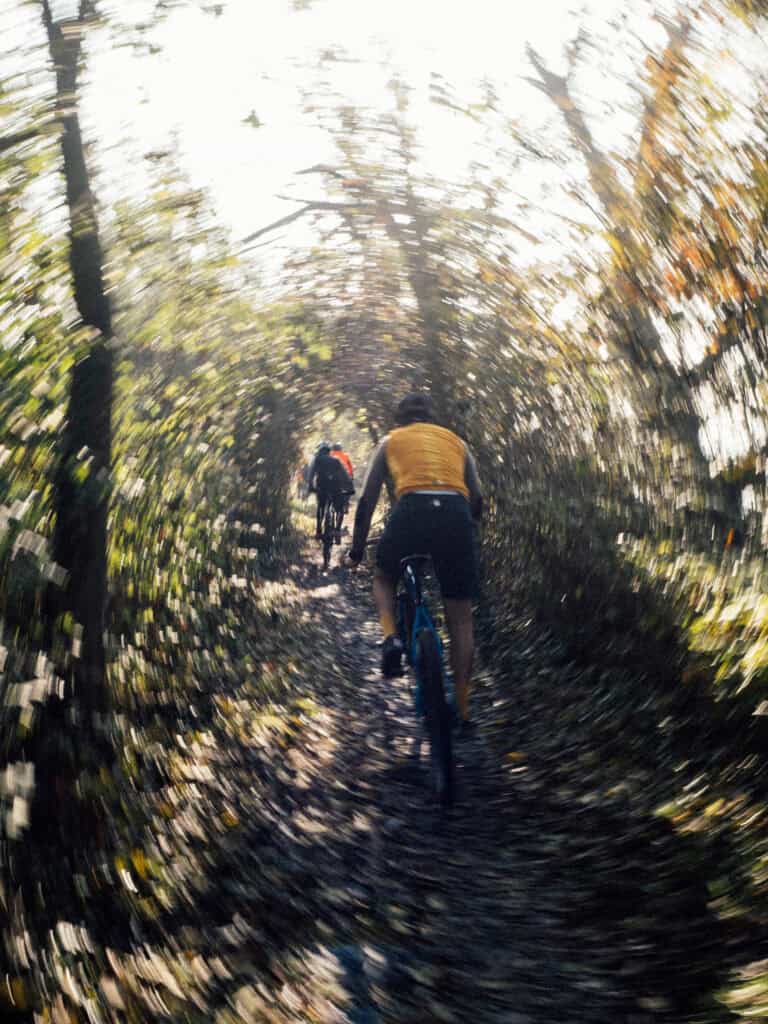 gravel cycling in th woods with dynamic effect